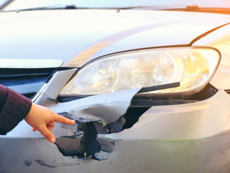 hand-point-to-front-side-of-accident-car-car-cras-2023-11-27-05-16-36-utc (1)
